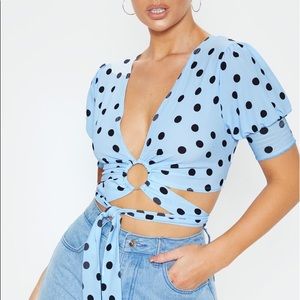 Blue polka dot wrap around top with ring